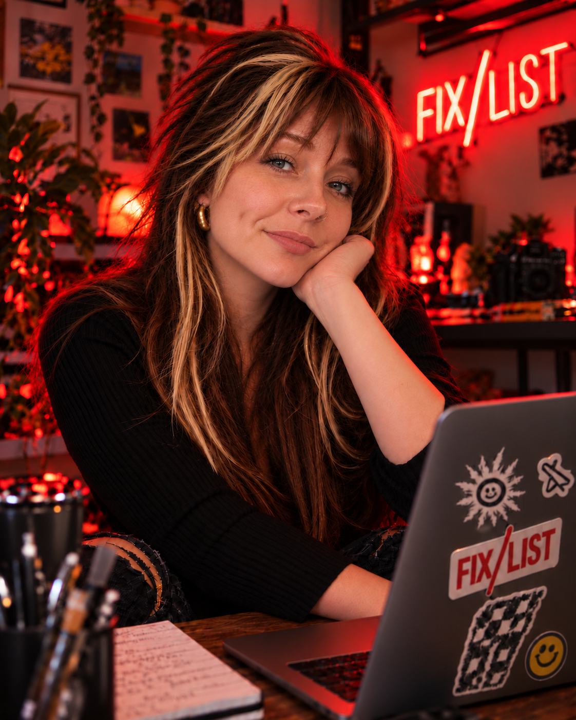 Rainey Howell, founder of FIX/LIST, in the red-lit FIX/LIST studio.